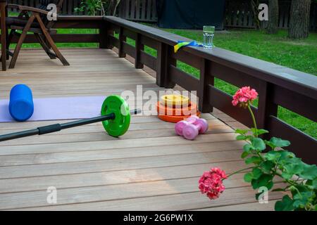 Home training equipment on home yard terrace. Fitness at home. Healthy, training and lifestyle concept. Stock Photo