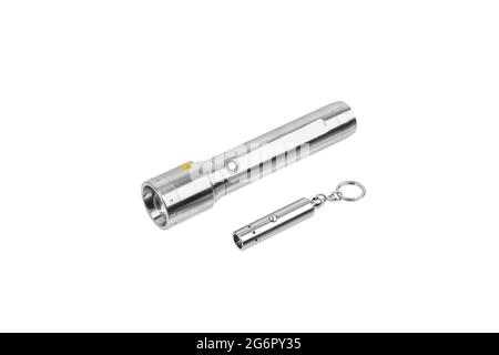 Modern silver metal LED flashlight. Pocket portable rechargeable lighting device. Isolate on a white background. Stock Photo