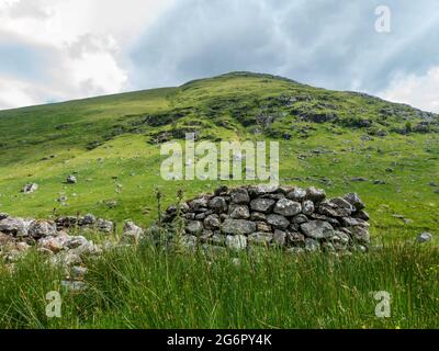 Old ruin of a building at the foot of the Munro mountain of Ben More near Crianlarich, Scotland, seen from Benmore Glen Stock Photo