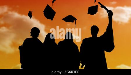 Composition of silhouettes of graduating students in gowns throwing caps against sunset sky Stock Photo