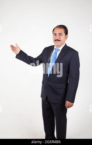 Mature senior company director CEO holding hand showing presentation Stock Photo