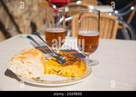 Spanish omelet and two glasses of beer. Spain. Stock Photo