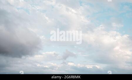Abstract clouds in the blue sky, different shapes. Stock Photo
