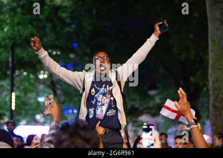 London, UK. 07th July, 2021. Football fans in Londonís west end celebrate England beating Denmark in the UEFA Euro 2020 semi-final. (Photo by Dave Rushen/SOPA Images/Sipa USA) Credit: Sipa USA/Alamy Live News Stock Photo
