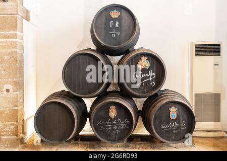 El Puerto de Santa Maria, Cadiz, Spain - June 15, 2021:  Exposure of barrels of Caballero in The San Marcos castle. In Wineries 'Gonzalez Byass', it's Stock Photo