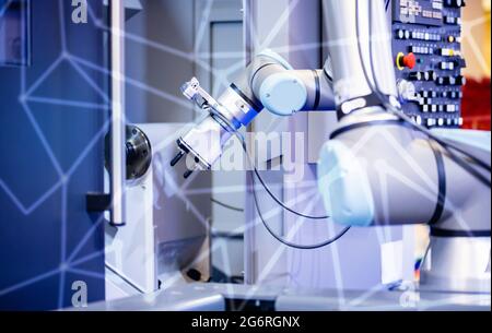Automatic machine robot arm tool in manufacture factory. Concept smart Industrial 4.0 technology. Stock Photo