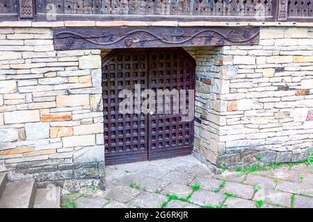 Wine cellar entrance . Wooden gate of traditional wine cellar Stock Photo