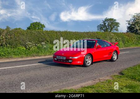 2000 red Toyota MR2 GT 16V 5 speed manual, 1998cc petrol 2dr coupe en-route to Capesthorne Hall classic May car show, Cheshire, UK Stock Photo