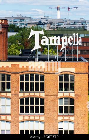 Old Tampella factory building with a logo on the roof in Tampere Finland Stock Photo