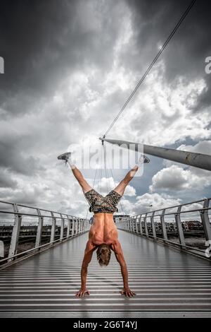 Man Doing Calisthenics Outdoors. Guy working out in the Street. Sport ...