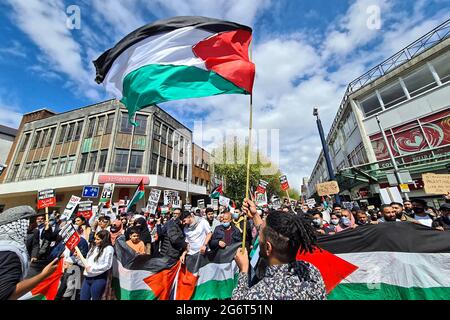 Pictured: Palestinian and local people hold a rally in Swansea, Wales ...
