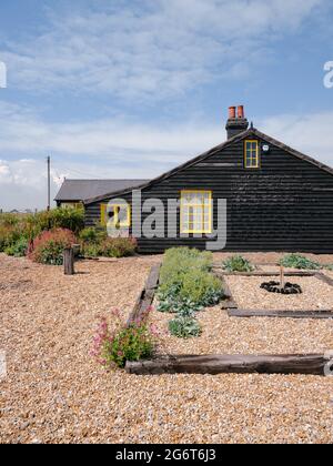 Prospect Cottage a Victorian fisherman's hut and shingle beach garden on the coast in Dungeness, Kent England UK summer 2021 - Derek Jarman's house Stock Photo