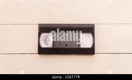 Flat lay view of an old vhs tape over a white wooden surface Stock Photo