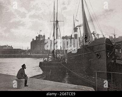 A late 19th century view of a solitary sailor in Leith, a port in the north of the city of Edinburgh, Scotland,  located on the southern coast of the Firth of Forth. It's marine activities included shipbuilding, fishing as an important entrepôt for the Scottish herring trade, and whaling. The latter took place in local, and Icelandic waters (the last whale in the Firth of Forth was caught in 1834. Stock Photo