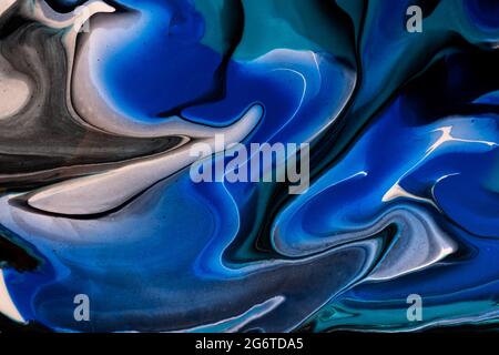 Abstract fluid art background navy blue and black colors. Liquid marble. Acrylic painting on canvas with sapphire lines and gradient. Alcohol ink back Stock Photo
