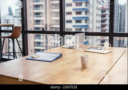 Interior of laptop, business file, glass, business paper put on wooden desk in the office. Take a break, bankrupt, unemployment, work from home concep Stock Photo