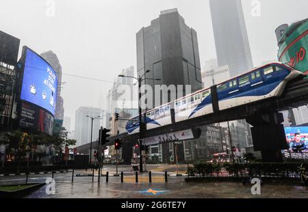 Kuala Lumpur, Malaysia. 08th July, 2021. A light transit train moves past the deserted street during heavy downpour in downtown. (Photo by Wong Fok Loy/SOPA Images/Sipa USA) Credit: Sipa USA/Alamy Live News Stock Photo