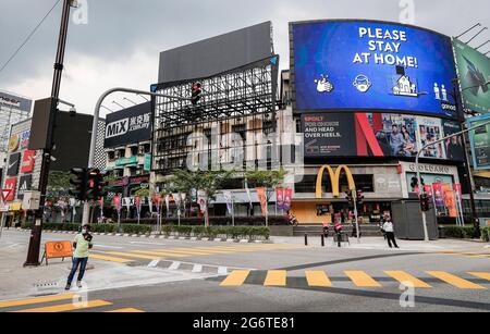 Kuala Lumpur, Malaysia. 08th July, 2021. A pedestrian waiting to cross the road on a deserted street in downtown. (Photo by Wong Fok Loy/SOPA Images/Sipa USA) Credit: Sipa USA/Alamy Live News Stock Photo