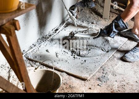 Cement mortar ready for plastering onto wall in home renovation Stock Photo
