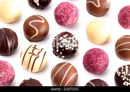 A Variety of Chocolate Truffles Isolated on a White Background Stock Photo