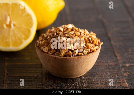 Dehydrated Lemon Peel on a Rustic Wooden Table Stock Photo