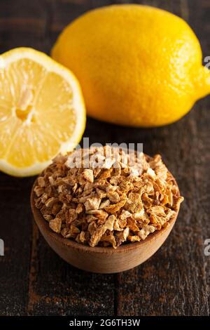 Dehydrated Lemon Peel on a Rustic Wooden Table Stock Photo