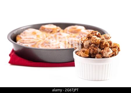 Frosted Cinnamon Roll Flavored Gourmet Popcorn Isolated on a White Background Stock Photo