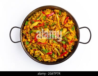 spanish paella rice with chicken on white background Stock Photo