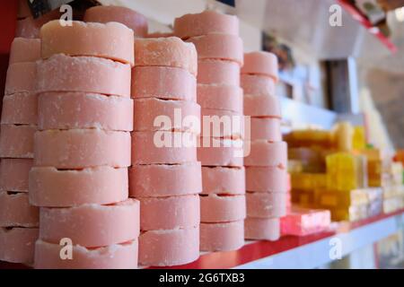 Craft multi-colored natural organic soap bars at shop shelf Stock Photo