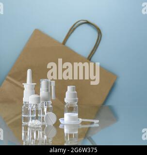 Pharmacy medicines on the background of a paper packaging bag. Stock Photo