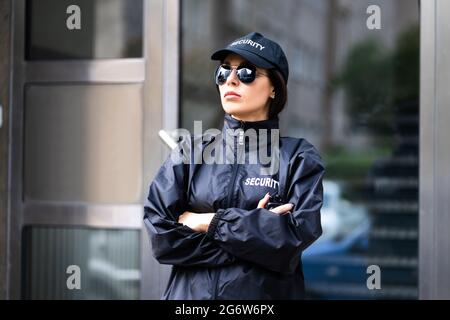 Security Guard Officer In Uniform. Guard Service Woman Standing Stock Photo