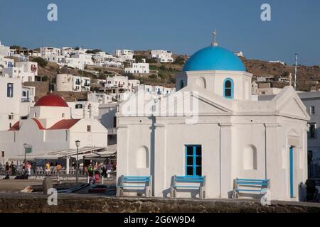 Agios Nikolaos church with blue dome on the waterfront in Chora, a village on the Greek island of Mykonos Stock Photo