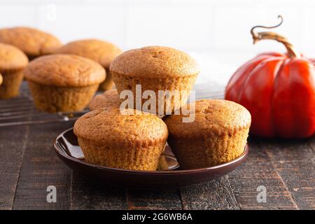 Pumpkin Spice Muffins on a Rustic Wooden Table Stock Photo
