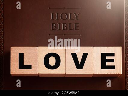 Love Spelled in Blocks on a Brown Leather Holy Bible Stock Photo