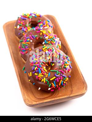 Cake Donut with Chocolate Frosting and Rainbow Colored Sprinkles Stock Photo