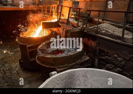 Special metallurgical ladles. The process of pouring molten metal Stock Photo