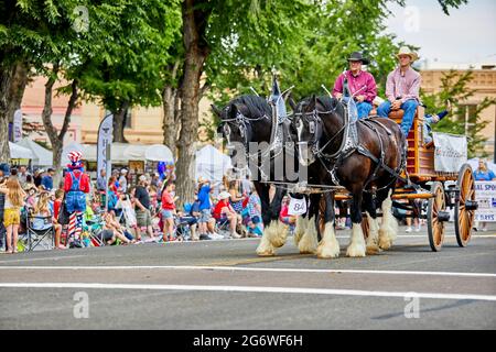 Prescott, Arizona, USA - July 3, 2021: Horse drawn wagon in the 4th of July parade Stock Photo