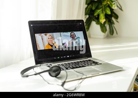 Online conference of colleagues through a laptop. Video call for training. Educational webinar chat between different people. Team meeting. Stock Photo