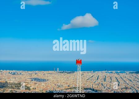Barcelona, Spain. 30th June, 2021. Tourists view scenery on a vantage point at the Tibidabo Amusement Park in Barcelona, Spain, June 30, 2021. The economic growth in the European Union (EU) and in the eurozone would expand by 4.8 percent this year, and by 4.5 percent in 2022, according to the Summer 2021 Economic Forecast issued by the European Commission on July 7. Credit: Zhang Cheng/Xinhua/Alamy Live News Stock Photo