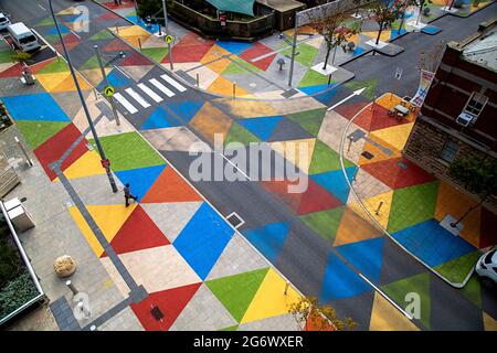 Colourful painted streets in Perth near the WA Museum, viewed from above with a single pedestrian walking Stock Photo