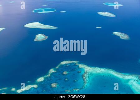 Maldives Beach Reef Sand. taken from different beaches of islands located in Maldives. Aerial view of coral sand cay on Great Barrier Reef, Queensland Stock Photo