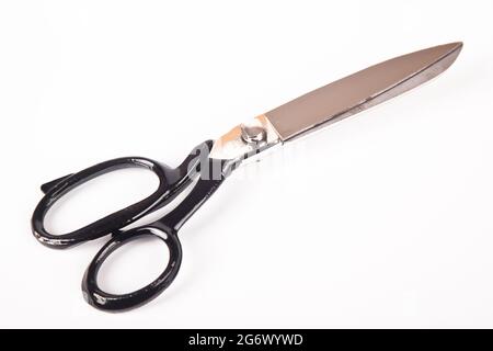 Very sharp retro professional tailor scissors, isolated on white background Stock Photo