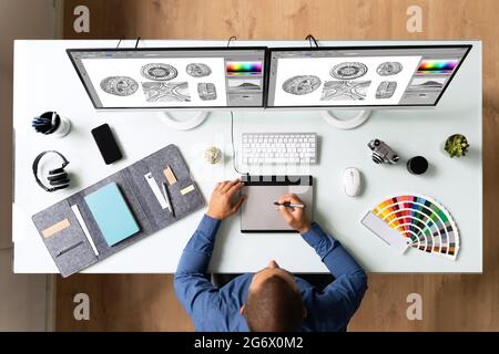Graphic Web Designer Artist Using Computer To Design Stock Photo