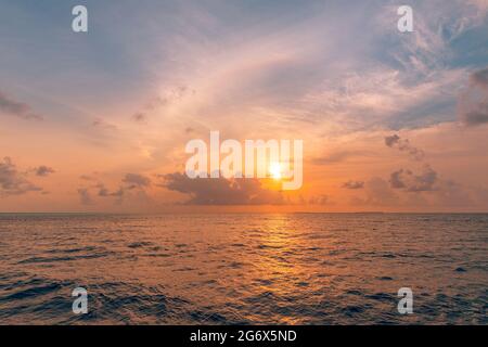 Closeup sea beach. Panoramic beach landscape. Inspire tropical beach seascape horizon. Orange and golden sunset sky calmness tranquil relaxing Stock Photo