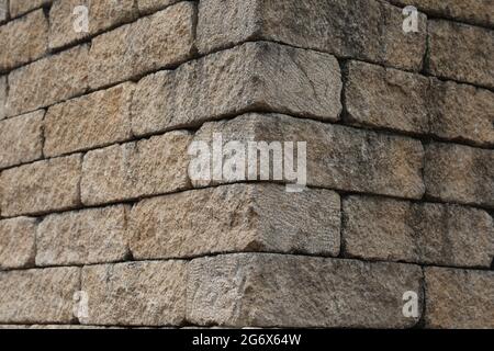 House wall made of gray natural stone. Stock Photo