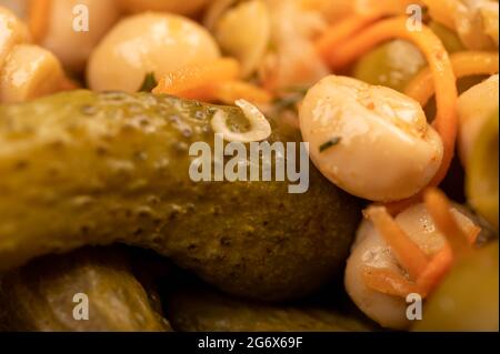 Pickled mushrooms and pickled cucumbers. Close-up Selective focus Stock Photo
