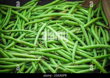 Fresh green beans on display at Broadway Market, a street market in Hackney, East London Stock Photo