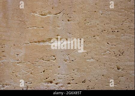 detail of a view of a piece of weathered and eroded natural stone wall Stock Photo