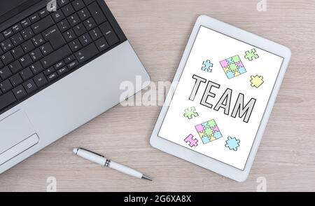 Team concept shown on a digital tablet Stock Photo