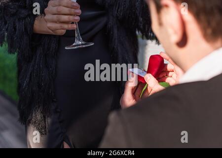 partial view of man making proposal to woman outdoors Stock Photo